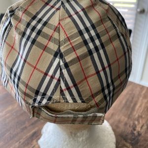 Women’s cap tan black red white stripes.